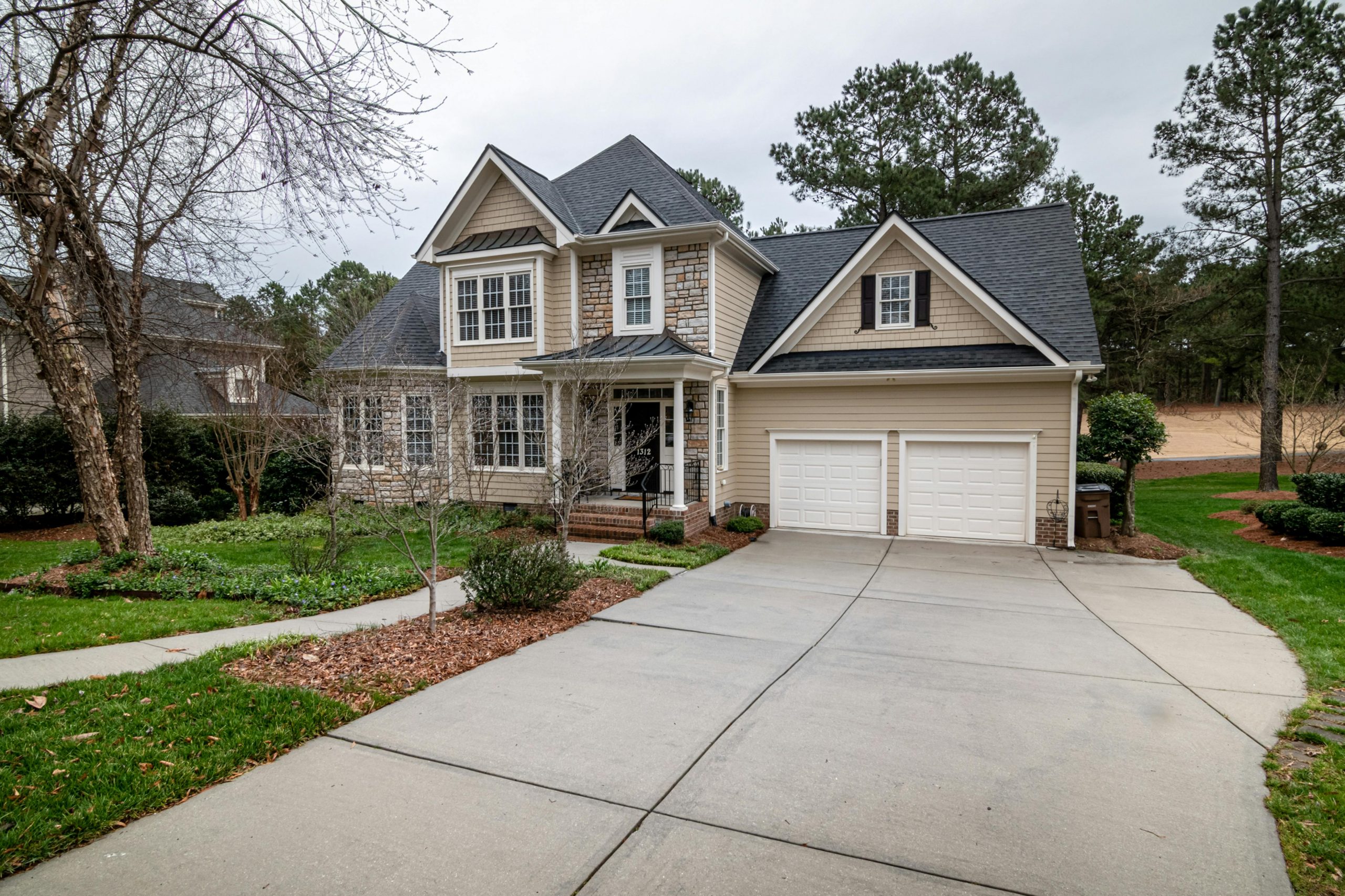house with two white garage doors